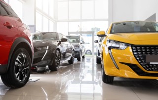 Modern cars in a dealers showroom | Featured image for Most Reliable Cars Australia blog by FinanceBeagle.